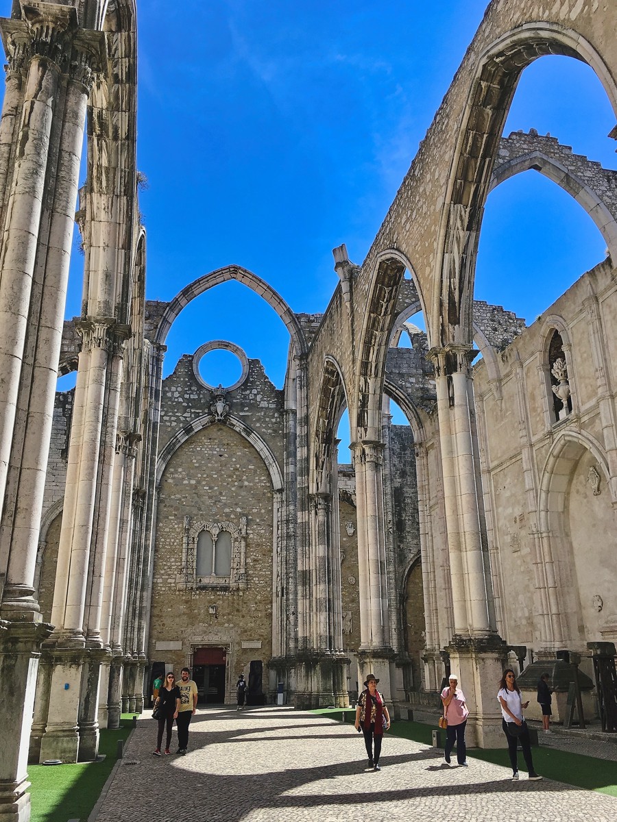 The roofless Carmo Convent still carries the memory of Lisbon’s 1755 earthquake.