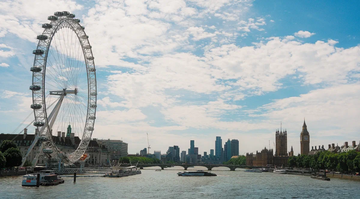 Looking upriver from the Golden Jubilee Bridges: the London Eye, Westminster, and the towers of Nine Elms beyond.